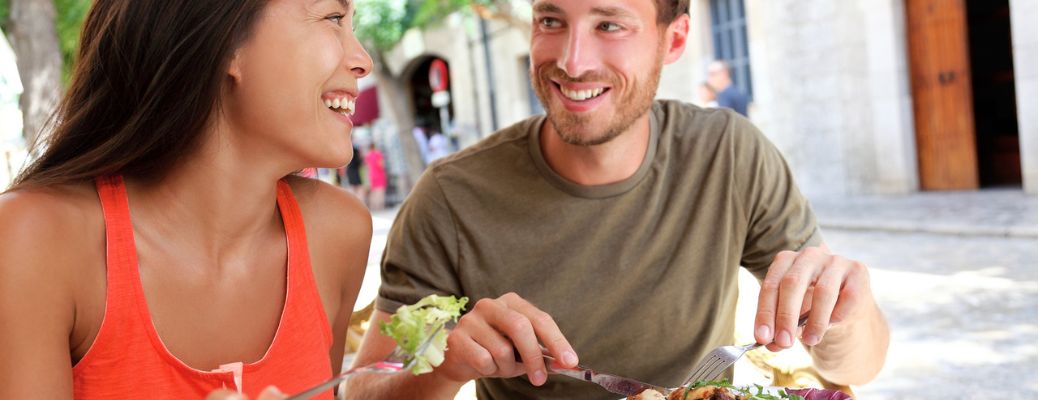 a couple eating outside