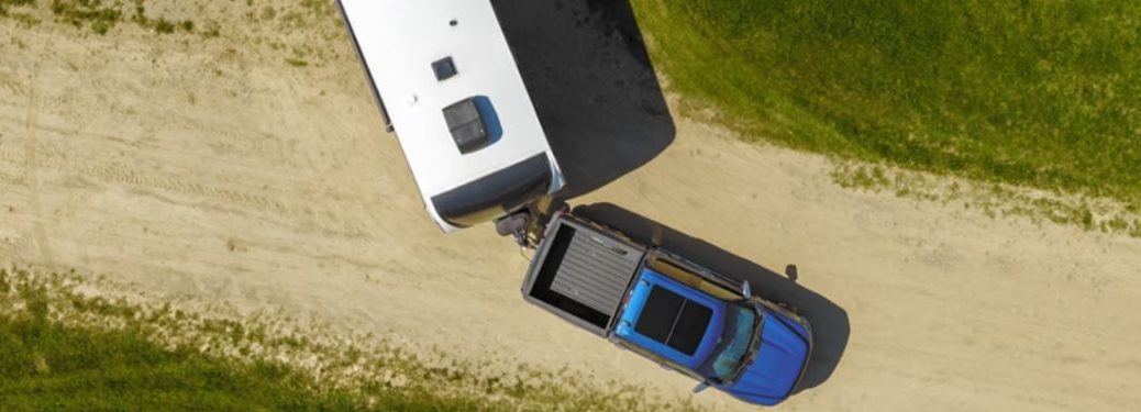 top view of the 2024 Ford F-150® reversing while towing