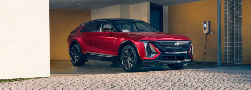 front quarter view of a Cadillac EV being charged at home