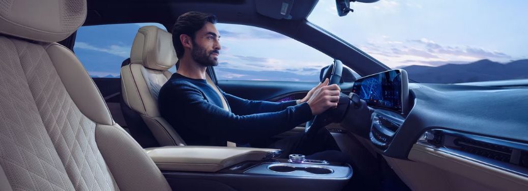 a man driving the 2025 Cadillac LYRIQ