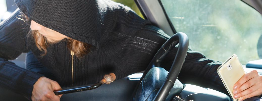 a man stealing a car