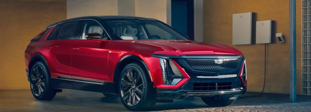 front view of a Cadillac EV getting charged at home