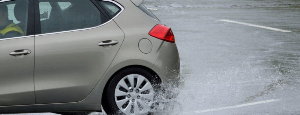 a car turning on the road in rain