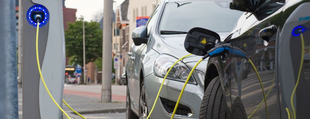 image of an EV getting charged at a public charging station