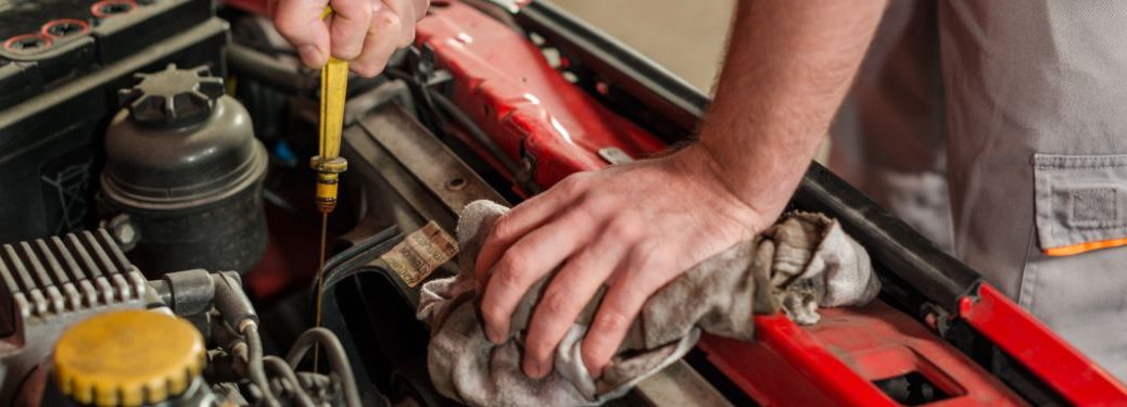 Hand of a mechanic working on a vehicle