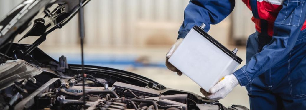 Hands of a man changing battery