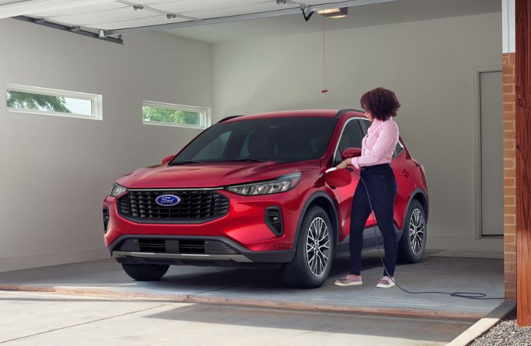 A woman entering the 2026 Ford Escape Active