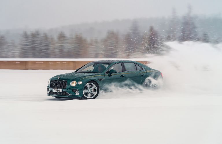 side view of a Bentley Flying Spur in snow