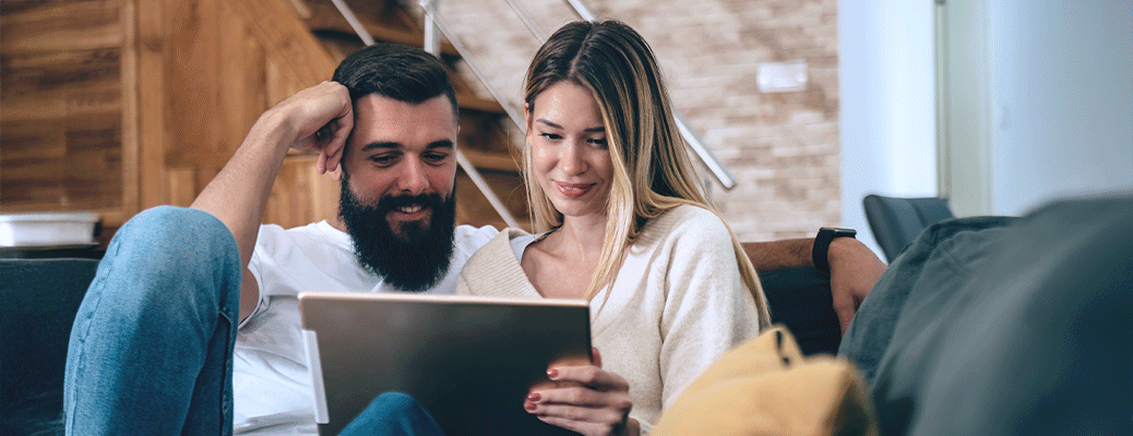two people looking at a tablet together