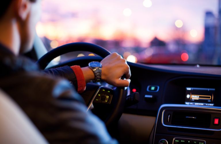 A man driving at night