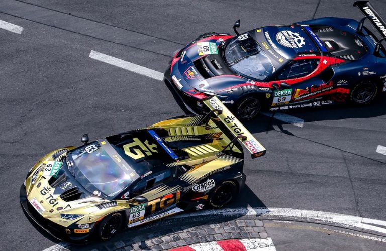 top view of cars racing on a curve