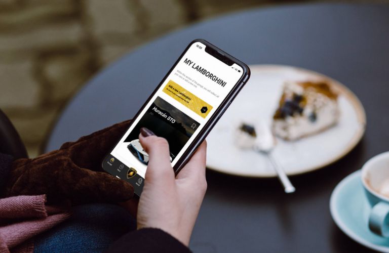 a hand using the Lamborghini UNICA app