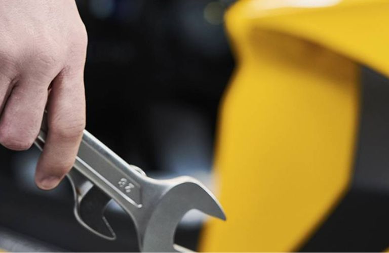 close up of a technician's hand holding tools