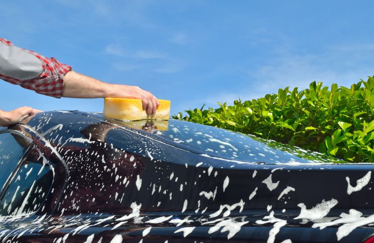 image of a car being washed by hand