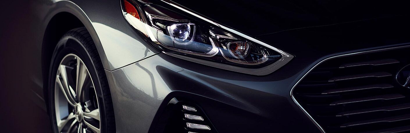 Isolated view of Hyundai Sonata headlight and wheel