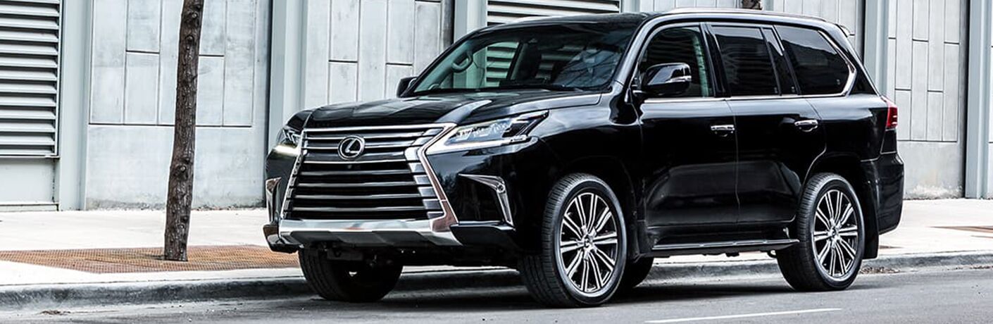 Black 2019 Lexus LX parked on city curb