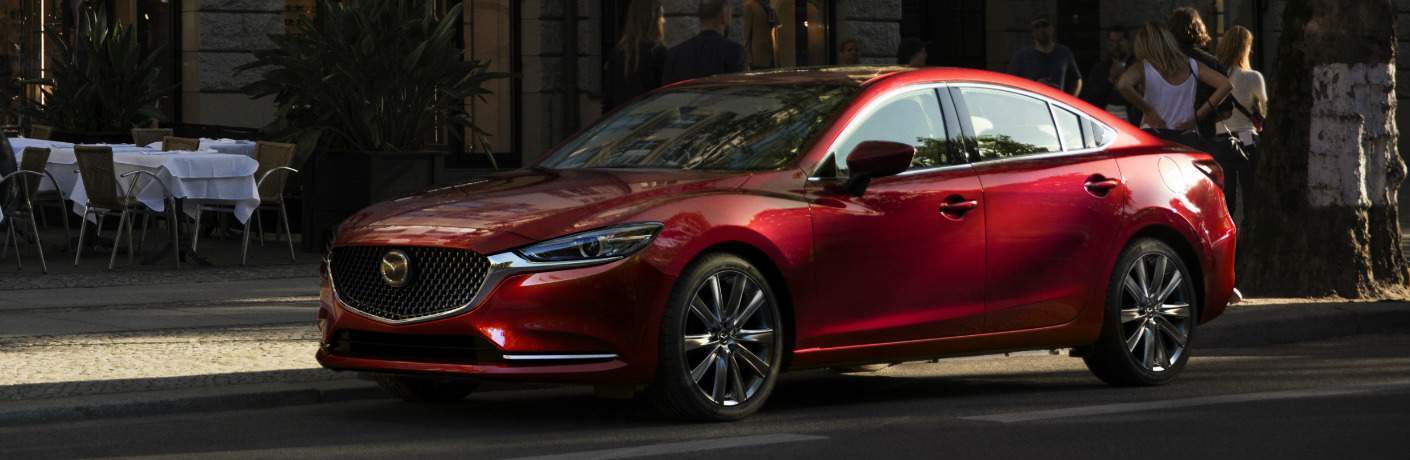 Red 2018 Mazda6 Parked next to a Restaurant