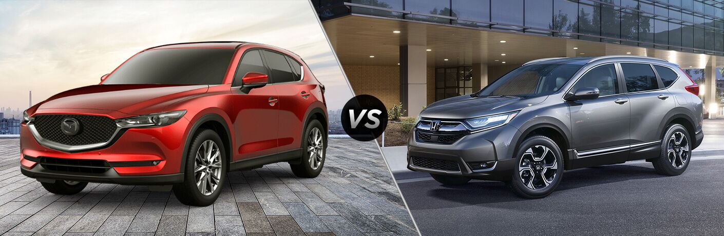 Red 2019 Mazda CX-5, VS icon, and grey 2019 Honda CR-V
