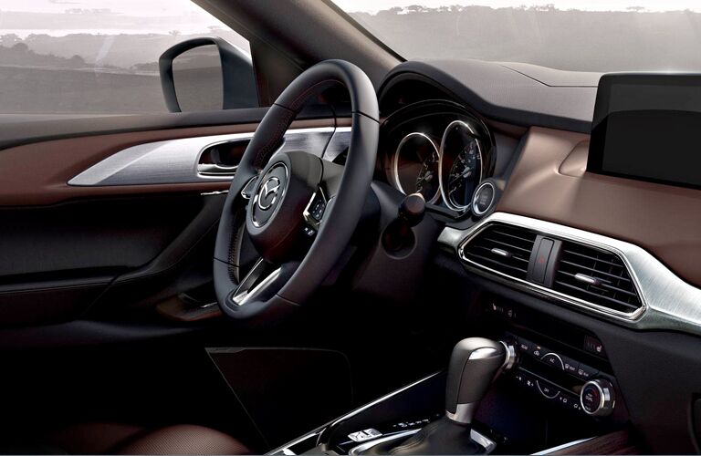 Steering wheel, gauges, and touchscreen in 2019 Mazda CX-9