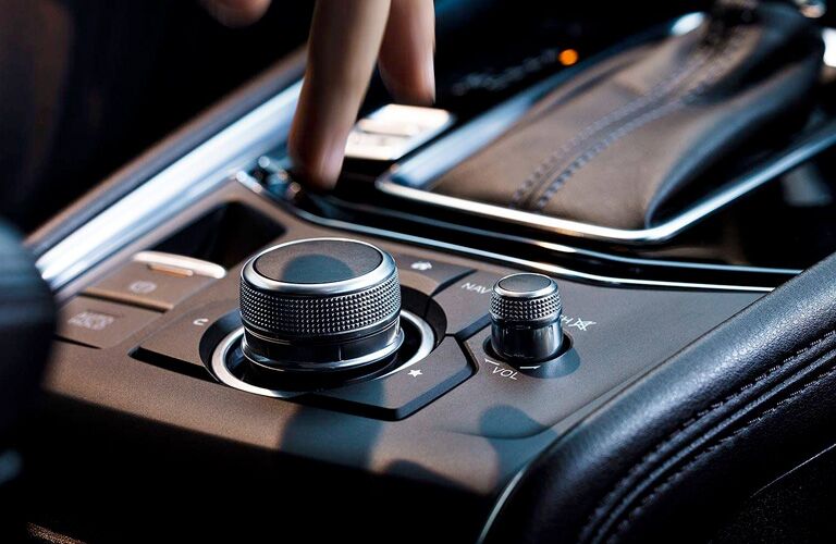 A person using the Commander Control Knob in a 2019 Mazda CX-5