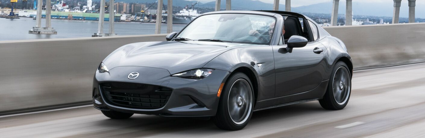 Grey 2019 Mazda MX-5 Miata RF Driving on a Bridge