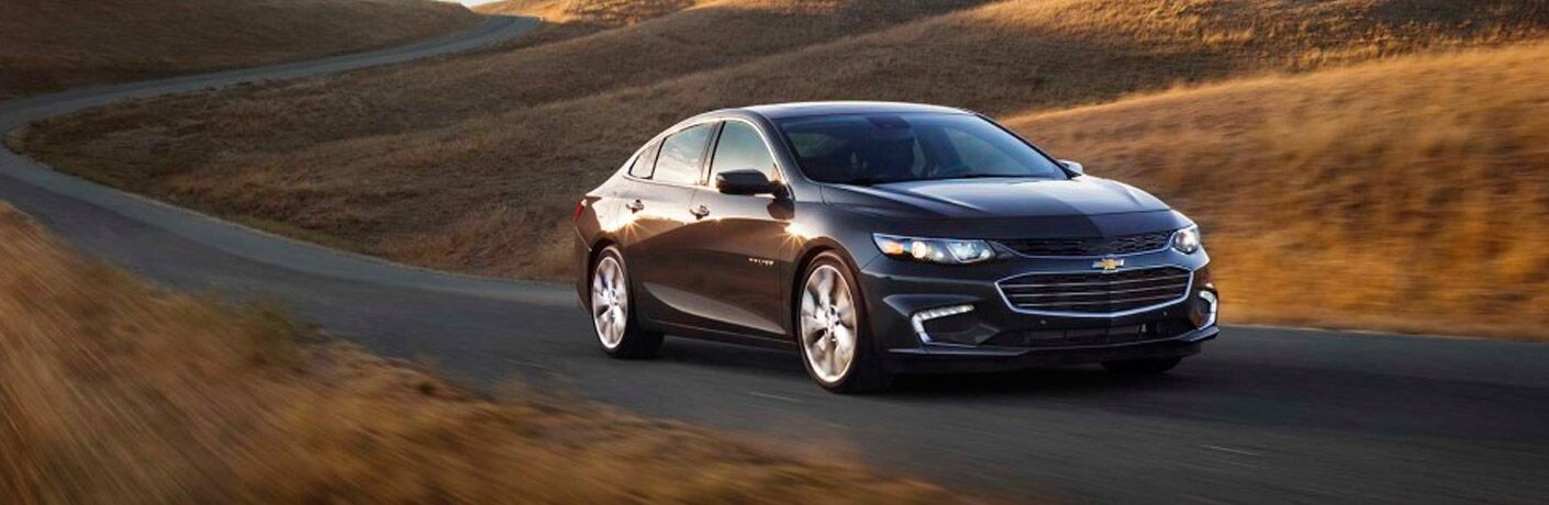 Used Chevrolet Malibu driving down road