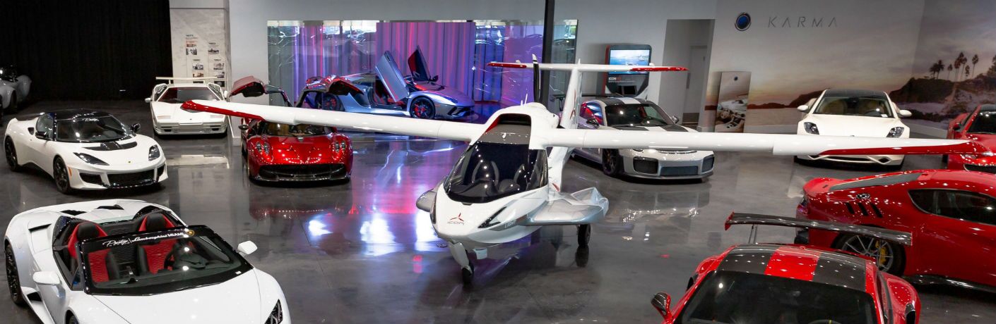 ICON A5 Aircraft Surrounded by Exotic Cars