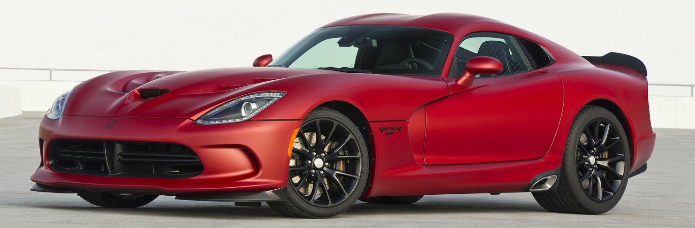 A left profile photo of a used Dodge Viper on a racetrack.