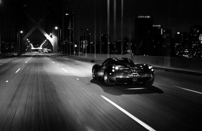 Pagani Model Driving Away at Night
