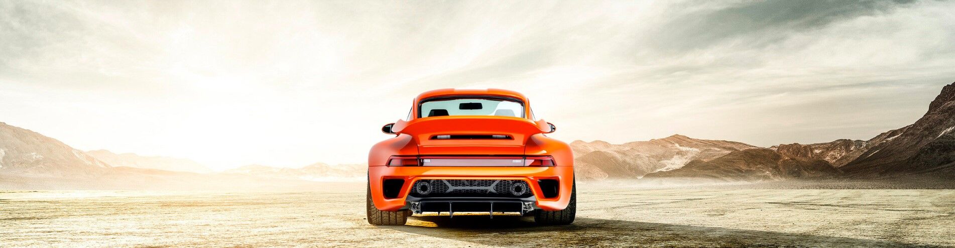 Porsche Turbo model in orange rear view