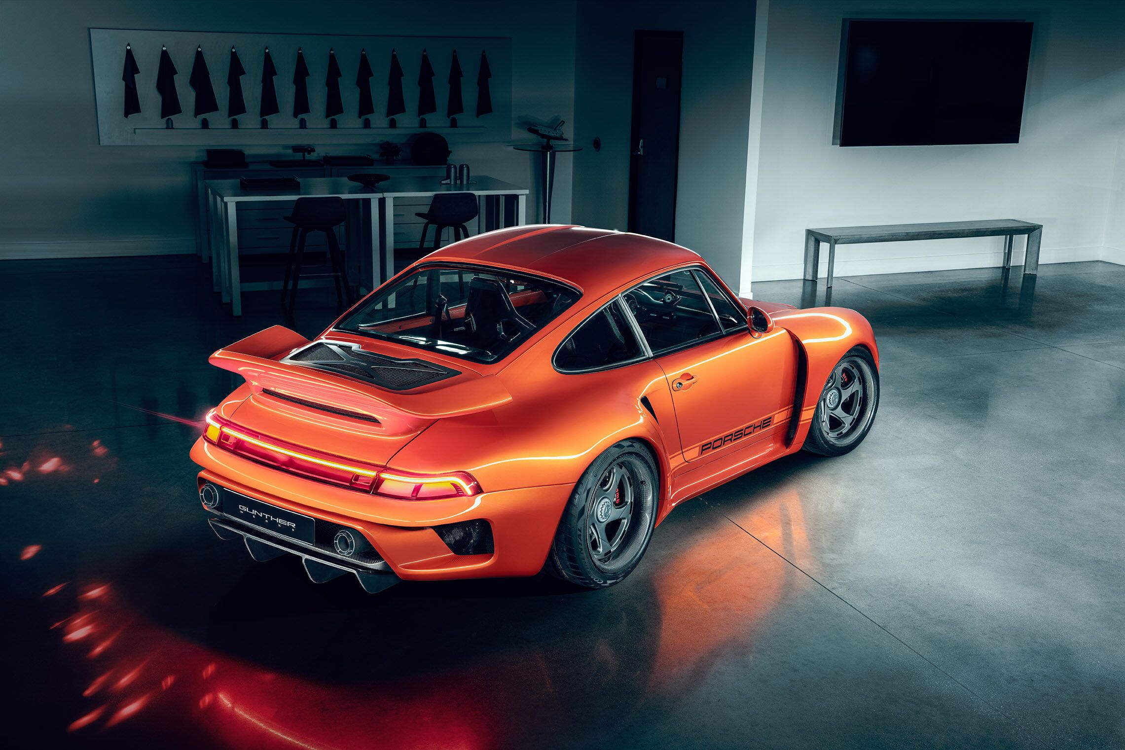 Porsche Turbo model overhead, rear, and side angle inside of a garage
