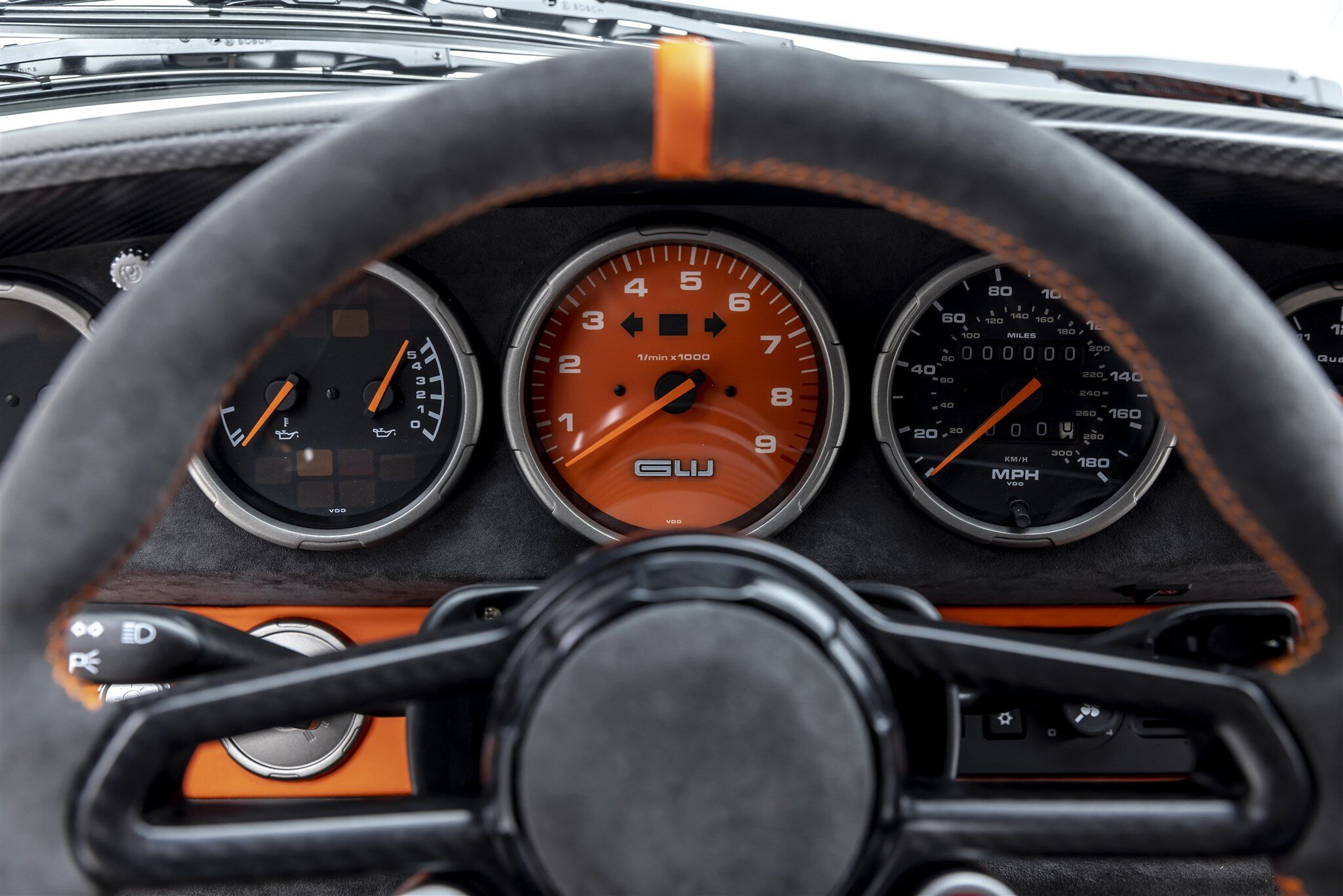 Porsche Turbo model steering wheel and instrument panel close up
