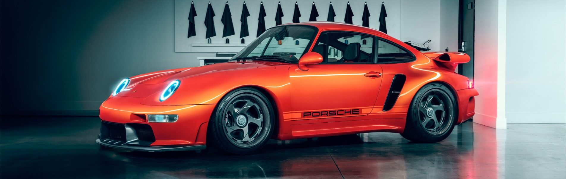 Porsche Turbo model in orange side view