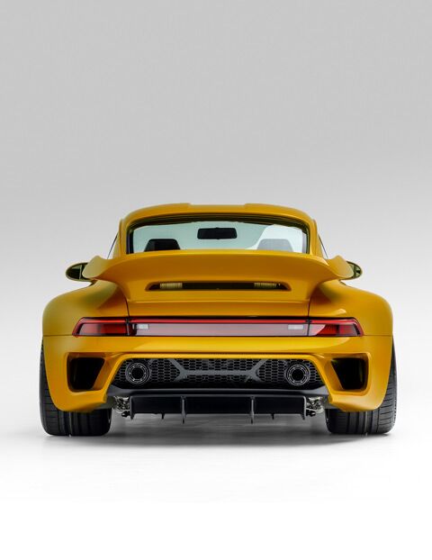 Porsche Turbo with yellow paint rear view