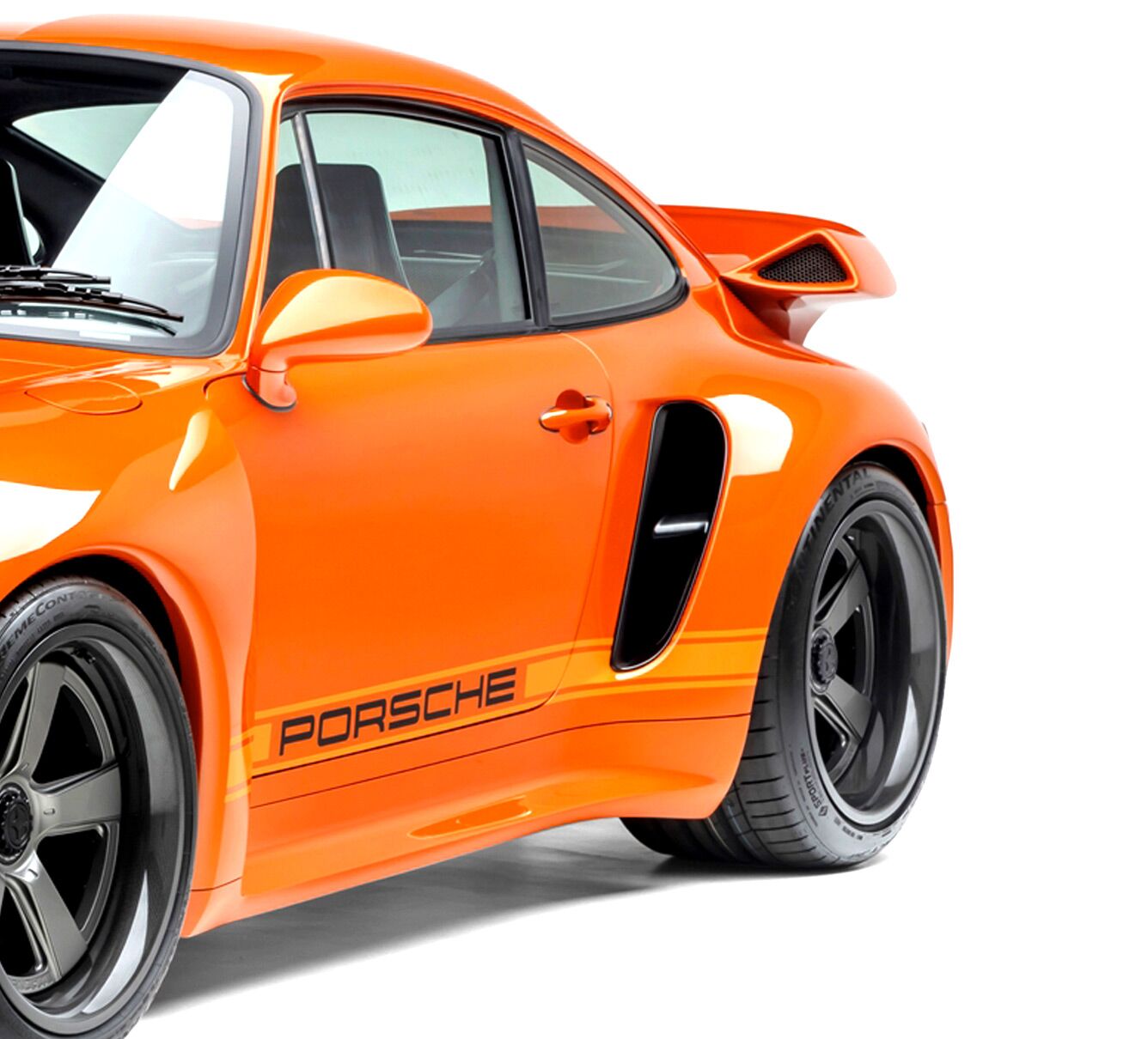 Orange Porsche Turbo model side view on white