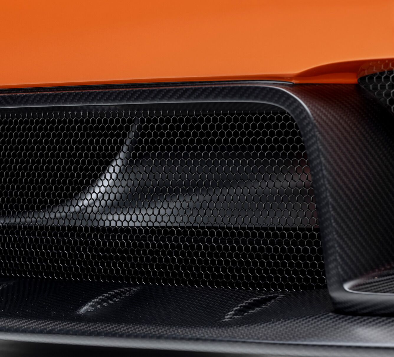 rear fender vents close up of an orange Porsche Turbo model