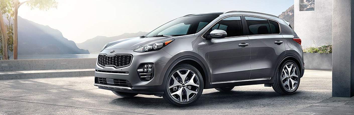 2018 Kia Sportage parked in large luxury driving in the mountains