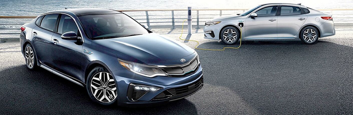 2020 Kia Optimas parked together by water