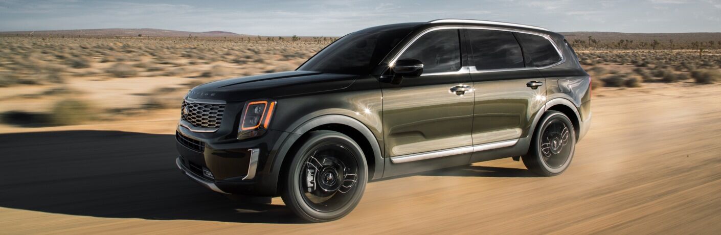 2020 Kia Telluride green in the sand side front view