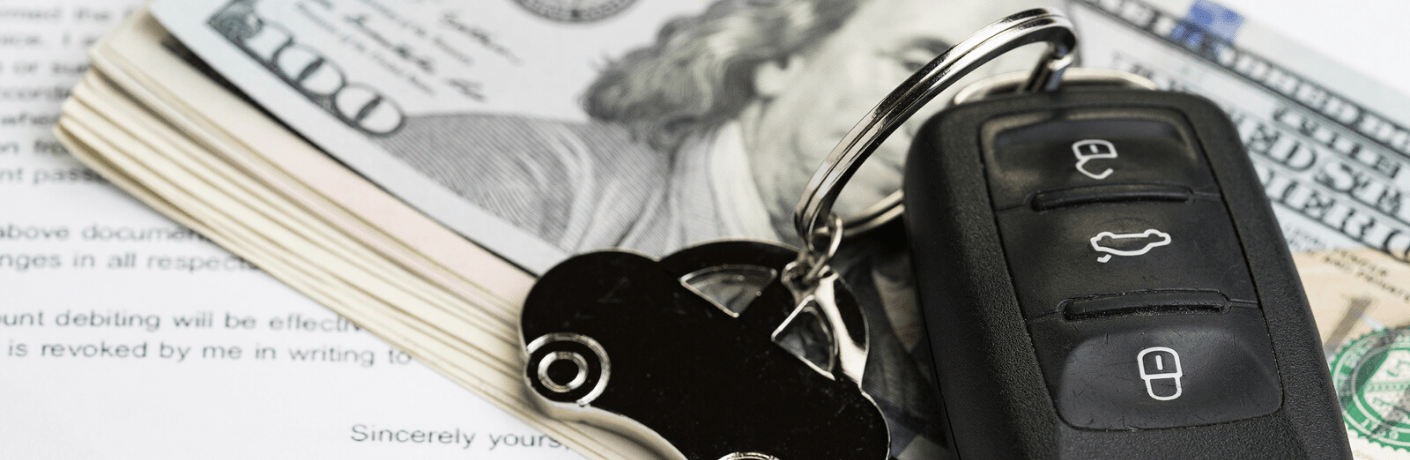 Car keys placed on stack of money