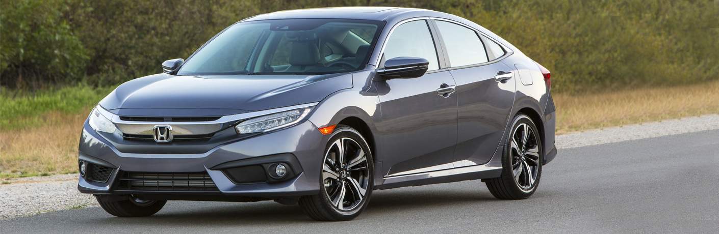 grey 2018 Honda Civic driving on the road