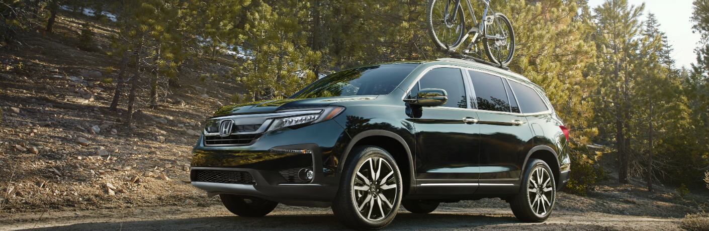 2019 Honda Pilot driving in the forest