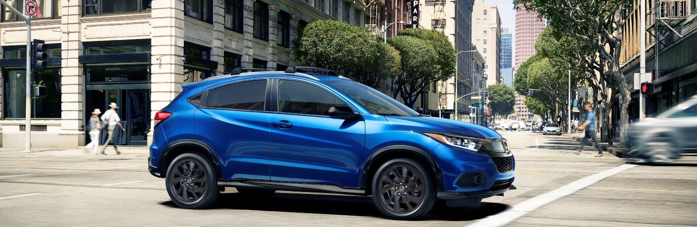 2021 Honda HR-V Sport blue driving through intersection in city