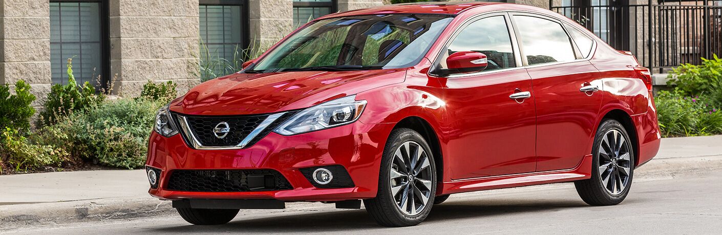 red 2019 Nissan Sentra parked in city
