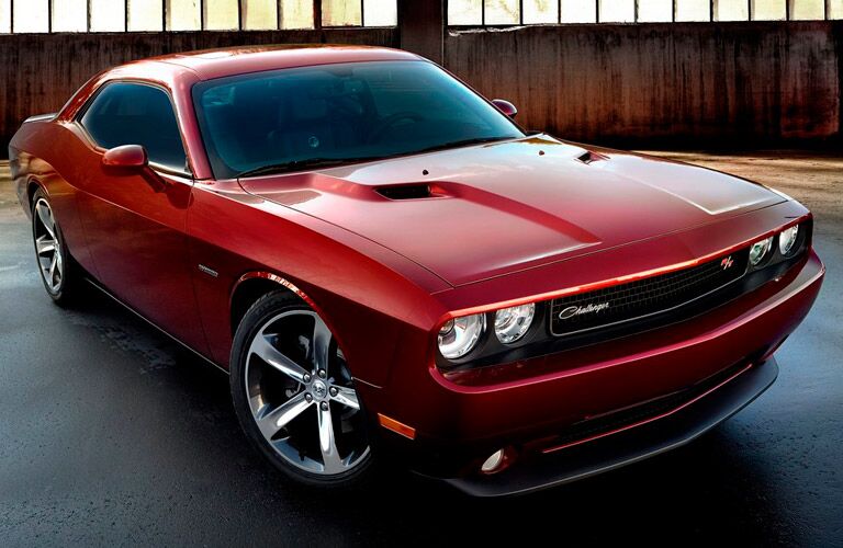 side view of a red 2014 Dodge Challenger