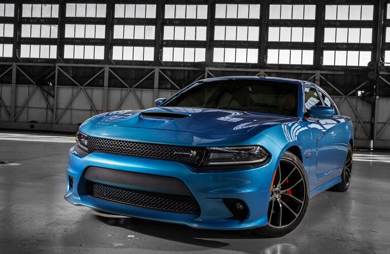blue 2016 Dodge Charger in a warehouse