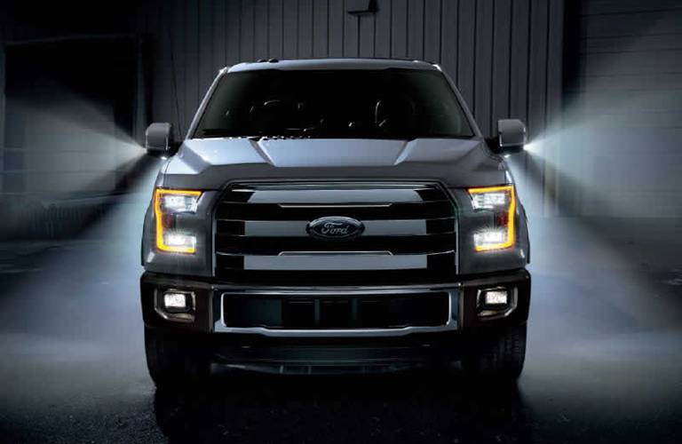 grille view of a 2016 Ford F-150 with dramatic lighting
