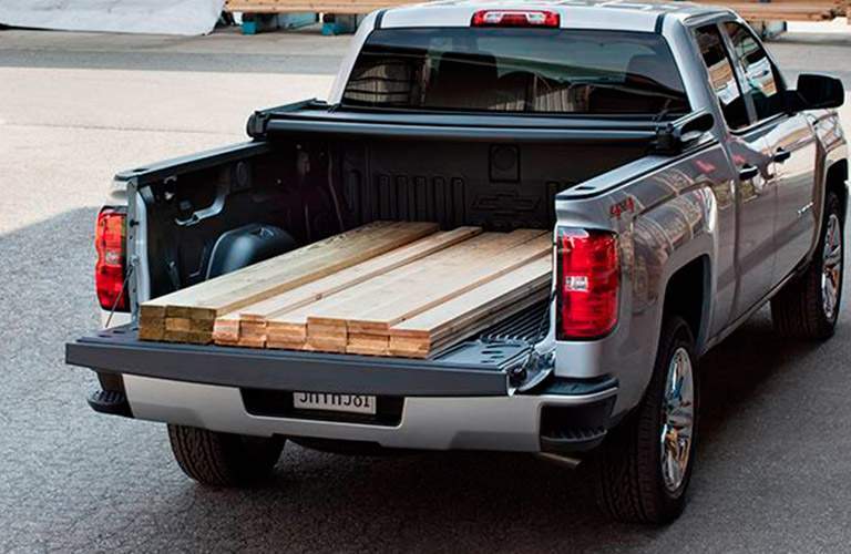 rear view of a 2017 Chevy Silverado loaded with lumber