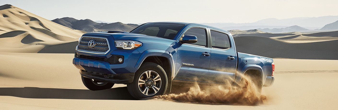Side view of the 2017 Toyota Tacoma in a desert