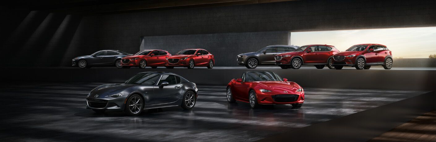 The full line-up of 2019 Mazda vehicles arrayed in a mysterious structure.
